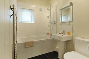 Combined shower/tub, hair dryer, towels, soap