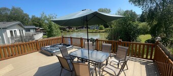 luxury lakeside lodge with a sunken hot tub on bull rush a peaceful feature lake @Tattershall lakes
