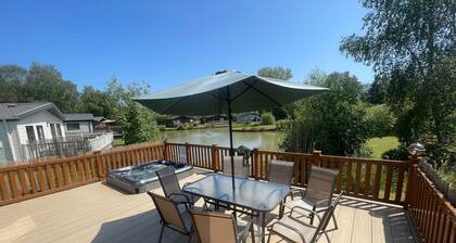 luxury lakeside lodge with a sunken hot tub on bull rush a peaceful feature lake @Tattershall lakes