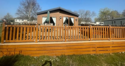 luxury lakeside lodge with a sunken hot tub on bull rush a peaceful feature lake @Tattershall lakes