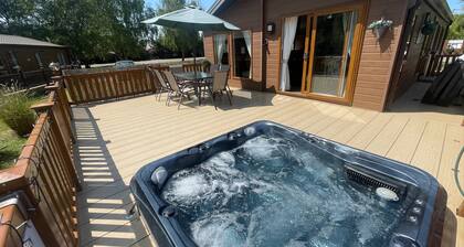 luxury lakeside lodge with a sunken hot tub on bull rush a peaceful feature lake @Tattershall lakes