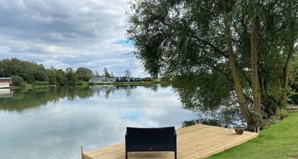 The Indulgence Lakeside Lodge is prime location with private fishing peg, sunken hot tub on Osprey