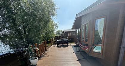 The Indulgence Lakeside Lodge is prime location with private fishing peg, sunken hot tub on Osprey