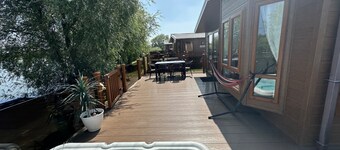 The Indulgence Lakeside Lodge is prime location with private fishing peg, sunken hot tub on Osprey