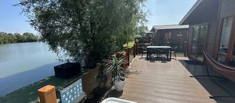 The Indulgence Lakeside Lodge is prime location with private fishing peg, sunken hot tub on Osprey