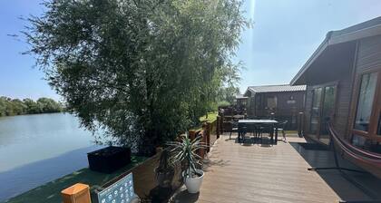 The Indulgence Lakeside Lodge is prime location with private fishing peg, sunken hot tub on Osprey