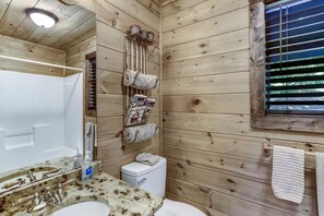 Combined shower/bathtub, hair dryer, towels, soap
