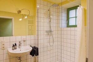 Shower, hair dryer, towels, soap