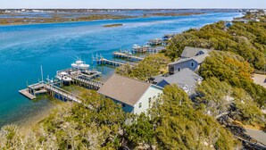 A coastal area with a dock, boats, and houses. - The Hydeaway | Pet Friendly, Soundfront with Dock! (Topsail Beach)
