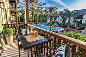 Outdoor dining - 5208-1 Pool front view- no carpet- balcony over pool courtyard w/ hot tub (St. Augustine)
