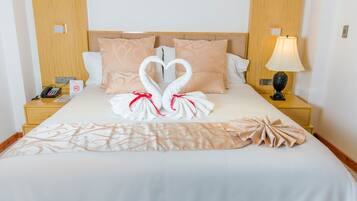 Premium bedding, down duvets, pillow-top beds, in-room safe
