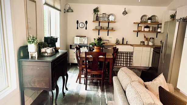 A modern kitchen with a dining area, wooden flooring, and a ceiling fan. - Our Nest, a well loved quiet retreat in Foxwood Hills Resort near Lake Hartwell. (Westminster)