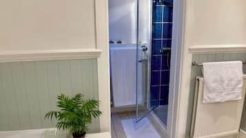 Bathtub, hair dryer, towels, soap