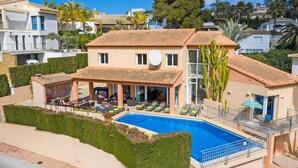 A two-story house with a swimming pool, a covered patio, and a satellite dish. - Villa Mar Flores by Villa Plus (Teulada)