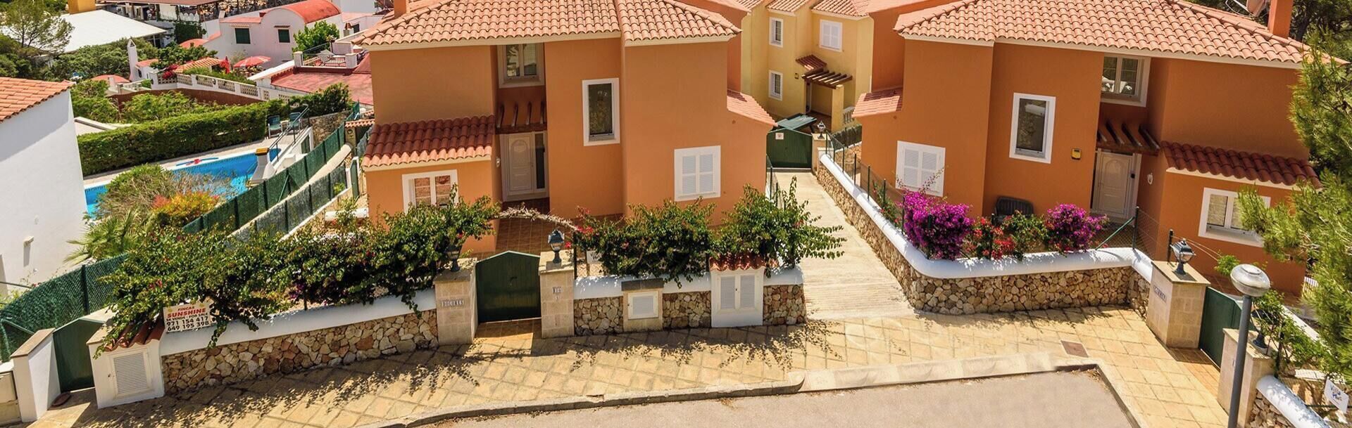 A coastal villa complex with multiple buildings, including Villa Dolores, Villa Miel, and Villa Carmen Galdana.