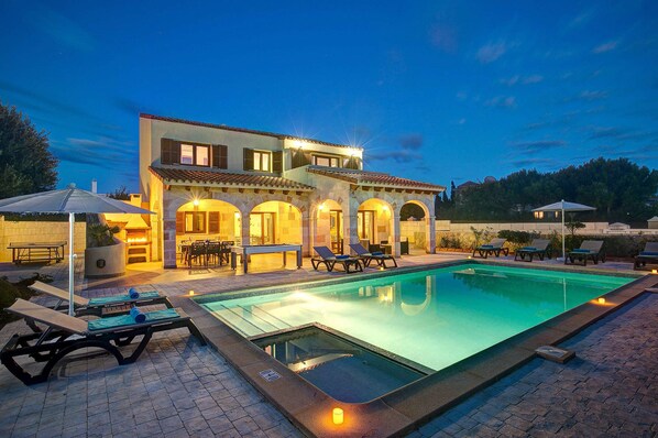 A two-story house with a swimming pool, outdoor seating, and a patio area. - Villa Mares by Villa Plus (Ciutadella de Menorca)
