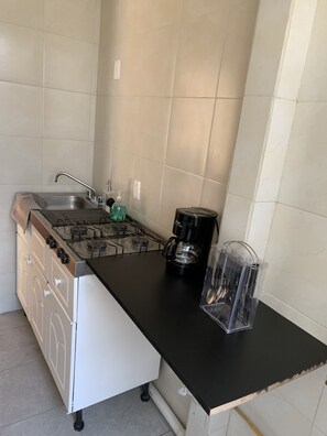 Fridge, microwave, stovetop, coffee/tea maker