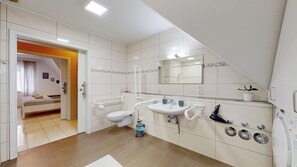 Bathtub, hair dryer, towels, soap