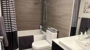 Combined shower/tub, towels, soap, toilet paper