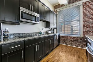 Fridge, microwave, oven, stovetop - Spacious Condo - Steps from French Quarter (New Orleans)