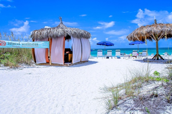 On the beach, white sand, beach towels, beach bar