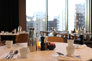 Enjoy a classic dining experience with a city view from the comfort of your table.