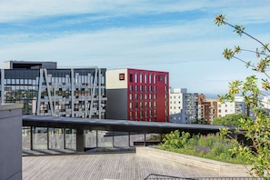 Enjoy panoramic views of the city from this rooftop terrace with a modern design.