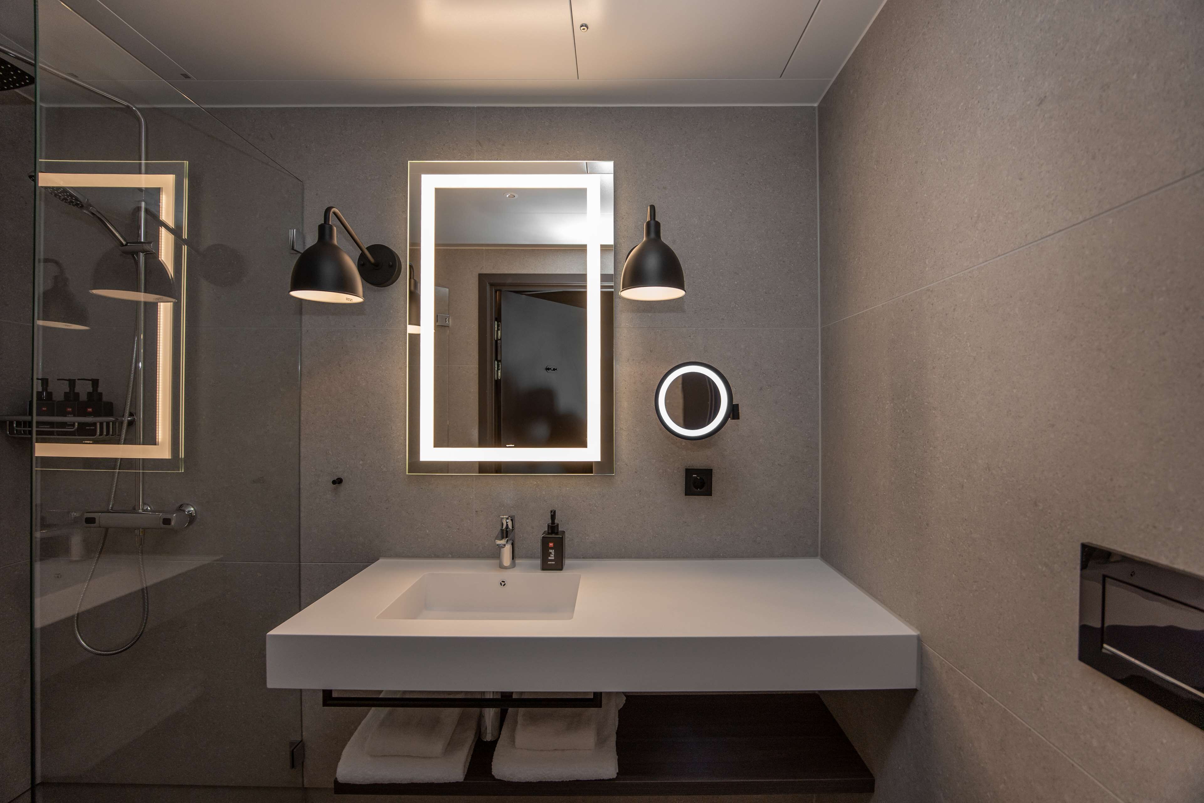 shower, rainfall showerhead, hair dryer, towels