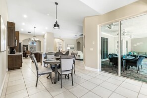 Enjoy family meals and relaxation in this spacious home with a dining area, kitchen, and comfortable living space.