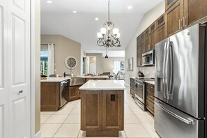 Fridge, microwave, oven, stovetop - Oversized saltwater heated pool w/lots of privacy! Villa Amore - SWFL Rentals (Cape Coral)
