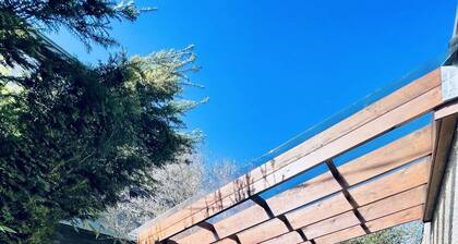 Family-friendly 3-bedroom modern home w/hot tub on park & 15 min to downtown!