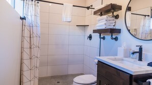 A modern bathroom with a shower, toilet, and sink. - Best View Ever #17 at The Dwellings (La Verkin)