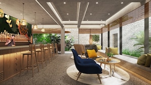 A modern bar area with wooden furniture and a bar counter, surrounded by a stone wall and large windows.