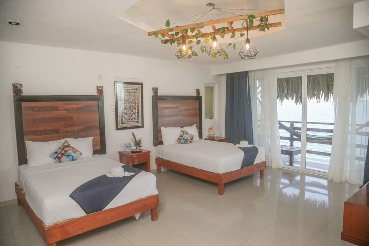 Suite familiar, vista a la laguna | 1 habitación, cortinas blackout, wifi gratis y ropa de cama
