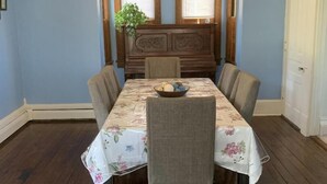 A dining room with a wooden table, chairs, and a ceiling fan. - Wineries, Hiking, skiing  and fishing minutes from house (Saylorsburg)