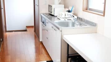 Fridge, microwave, cookware/dishes/utensils