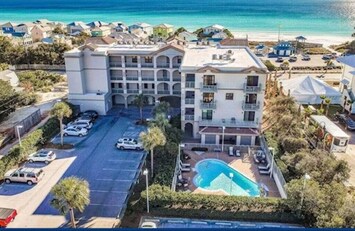 Aerial view of building with gulf behind