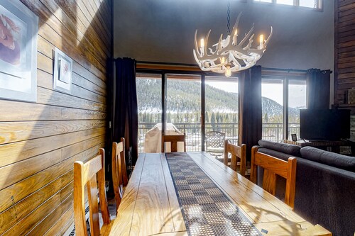 Water-view escape near the slopes with mountain vista, balcony, & fireplace