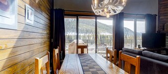 Water-view escape near the slopes with mountain vista, balcony, & fireplace