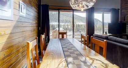 Water-view escape near the slopes with mountain vista, balcony, & fireplace