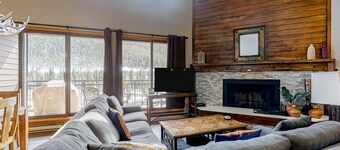 Water-view escape near the slopes with mountain vista, balcony, & fireplace
