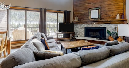 Water-view escape near the slopes with mountain vista, balcony, & fireplace