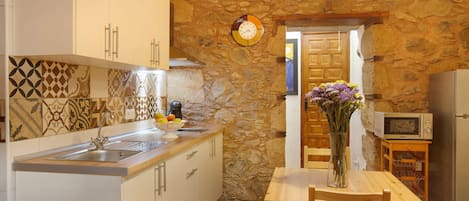 Fridge, microwave, stovetop, coffee/tea maker