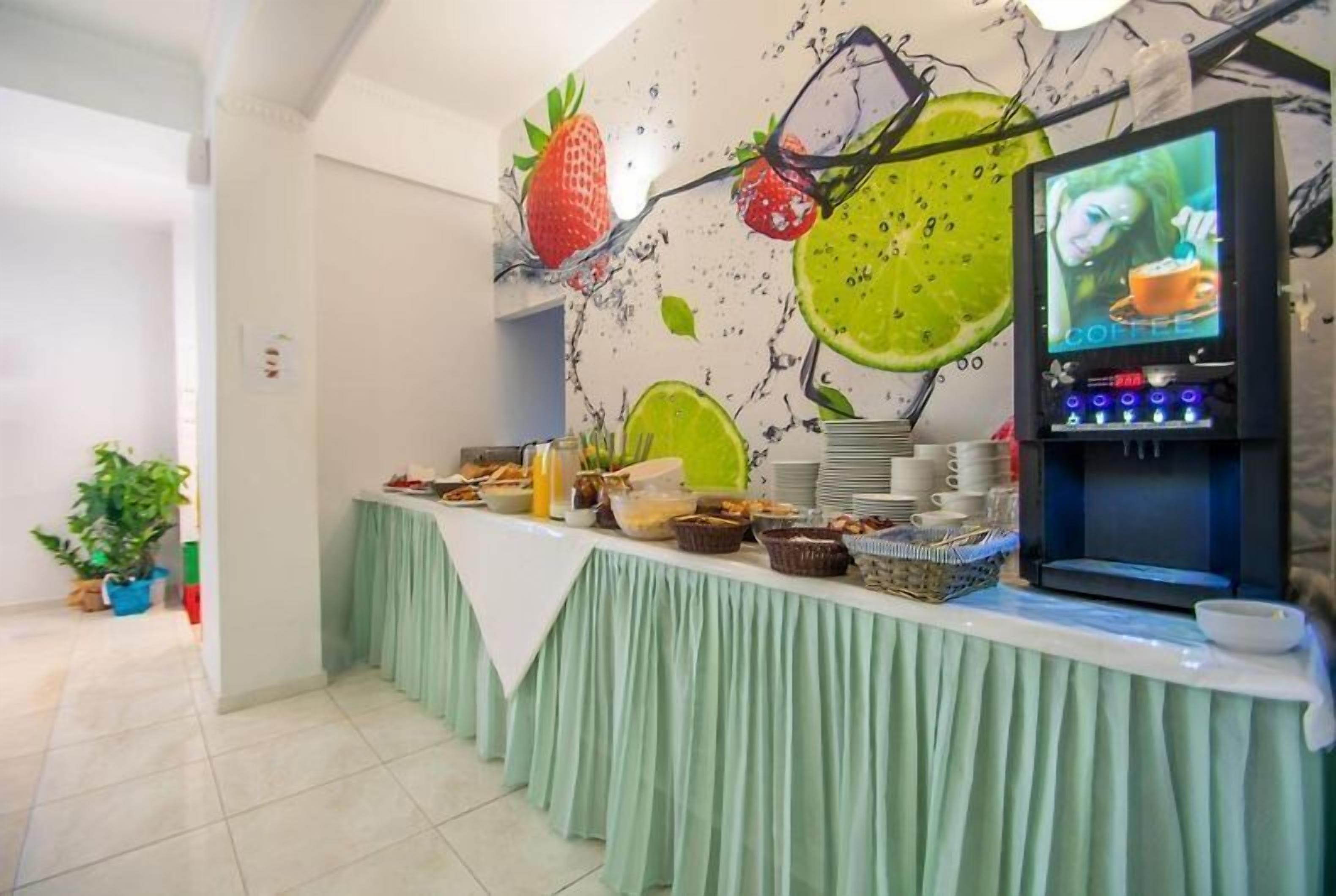 A buffet setup with a variety of food items and a coffee machine.