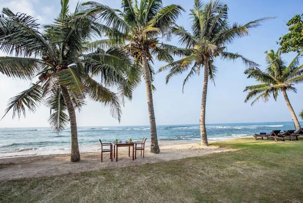 On the beach, sun loungers, beach towels