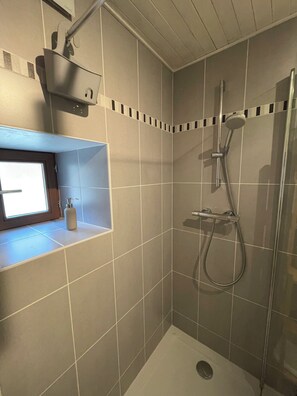 Shower, hair dryer, soap, shampoo