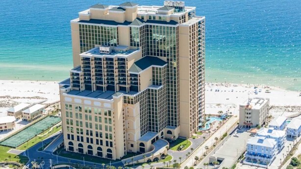 A high-rise hotel with multiple floors, a beach view, and a pool area. - Gulf Front - 3BR 4BA - Lazy River - The Oasis at Orange Beach (Orange Beach)