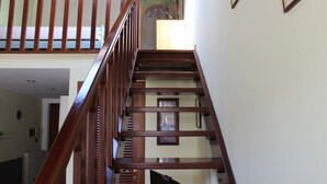 A wooden staircase with a handrail, leading to an upper floor. - Loft Angela Charming Aptmnt in Pietrasanta Center (Pietrasanta)