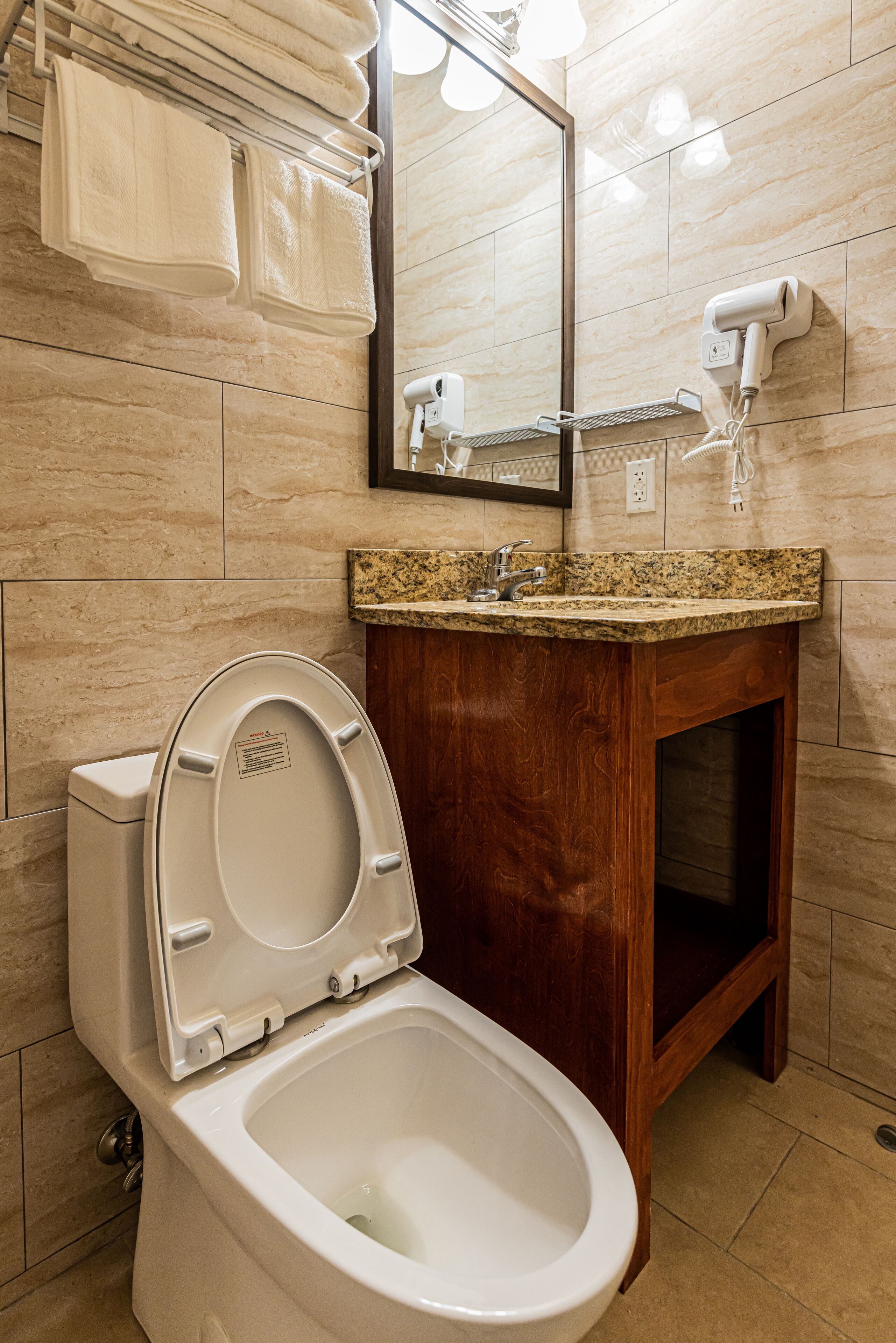 bathtub, hair dryer, towels