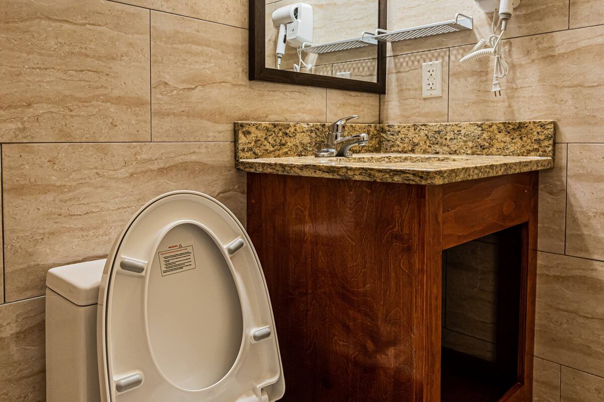 bathtub, hair dryer, towels